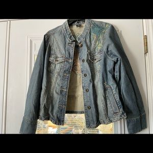 Beautiful embroidered pattern on light denim